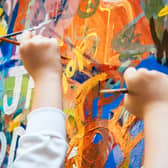 Kids painting a wall. Image: VTT Studio/adobe.stock