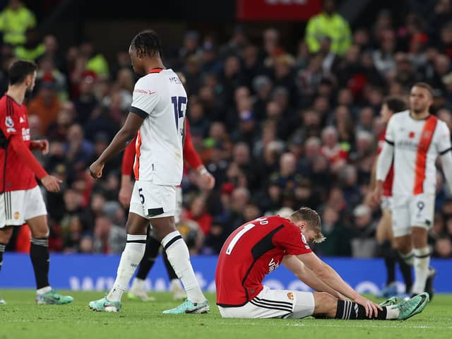 Rasmus Hojlund of Manchester United lies injured during the Premier League match between Manchester United and Luton Town at Old Trafford on November 11, 2023 in Manchester, England. (Photo by Matthew Peters/Manchester United via Getty Images)