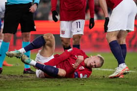 Erling Haaland lies on the pitch during the football friendly match between Norway and Faroe Islands in Oslo, Norway, on November 16, 2023. (Photo by Cornelius Poppe / NTB / AFP) / Norway OUT (Photo by CORNELIUS POPPE/NTB/AFP via Getty Images)