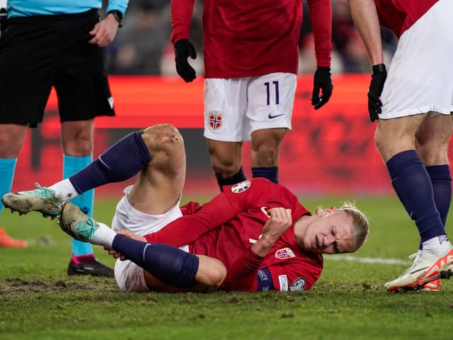 Erling Haaland lies on the pitch during the football friendly match between Norway and Faroe Islands in Oslo, Norway, on November 16, 2023. (Photo by Cornelius Poppe / NTB / AFP) / Norway OUT (Photo by CORNELIUS POPPE/NTB/AFP via Getty Images)