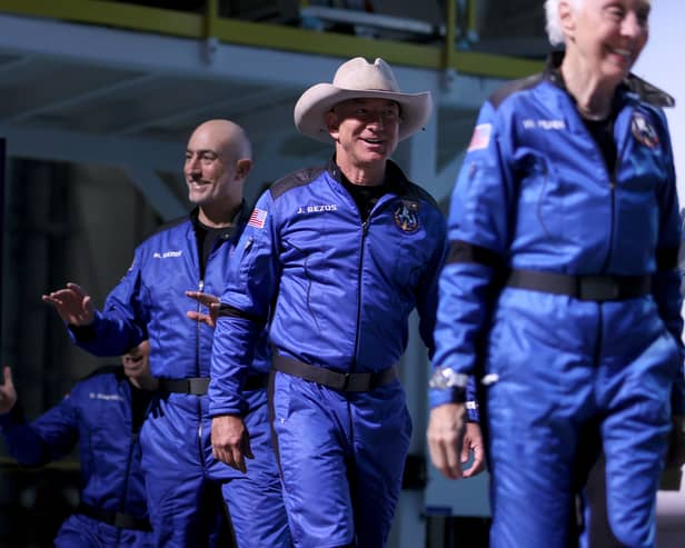 Mark Bezos, left and Jeff Bezos before boarding the  Blue Origin New Shepard rocket in July 2021. (Photo by Joe Raedle/Getty Images)