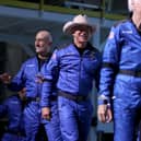 Mark Bezos, left and Jeff Bezos before boarding the  Blue Origin New Shepard rocket in July 2021. (Photo by Joe Raedle/Getty Images)