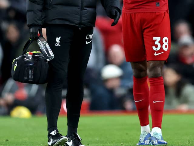 Ryan Gravenberch of Liverpool leaves the pitch following injury during the Premier League match between Liverpool FC and Manchester United at Anfield on December 17, 2023 in Liverpool, England. (Photo by Clive Brunskill/Getty Images)