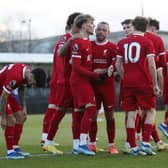 Bobby Clark of Liverpool celebrates with teammates after scoring their team's second goal during the Premier League 2 match between Liverpool FC U21 and Chelsea FC U21 at The Kirkby Academy on December 17, 2023 in Kirkby, England. (Photo by Liverpool FC/Liverpool FC via Getty Images)