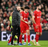 Luis Diaz of Liverpool leaves the field after sustaining an injury during the Premier League match between Liverpool FC and Arsenal FC at Anfield on December 23, 2023 in Liverpool, England. (Photo by Michael Regan/Getty Images)