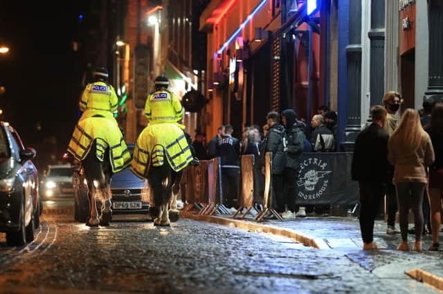 Police patrol in the centre of Liverpool. Image: LINDSEY PARNABY/AFP via Getty Images