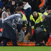 Dwight McNeil was stretchered off for Everton against Crystal Palace.   (Photo by GLYN KIRK/AFP via Getty Images)