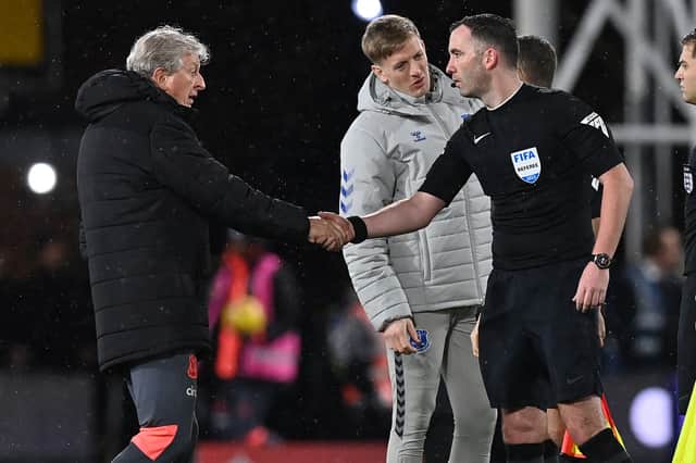 Crystal Palace manager Roy Hodgson shakes hands with Chris Kavanagh after his side's draw against Everton. (Photo by GLYN KIRK/AFP via Getty Images)