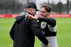 Tyler Morton of Liverpool embracing Jurgen Klopp manager of Liverpool during a training session at AXA Training Centre on July 10, 2023 in Kirkby, England. (Photo by Andrew Powell/Liverpool FC via Getty Images)