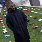 Idris Elba stands in front of an installation of over 200 bundles of clothing representing the lives lost to Knife crime in the UK as he calls on the Government to take immediate action to prevent serious youth violence at Parliament Square on January 08, 2024. (Photo by Jeff Spicer/Getty Images for Don't Stop Your Future)