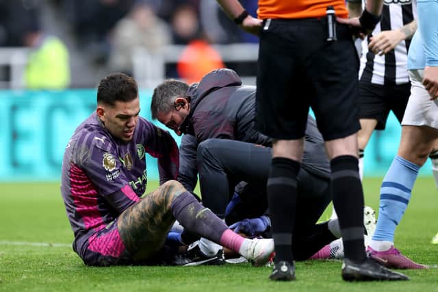 Ederson of Manchester City receives medical treatment during the Premier League match between Newcastle United and Manchester City at St. James Park on January 13, 2024 in Newcastle upon Tyne, England. (Photo by Alex Livesey/Getty Images)