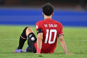Mohamed Salah reacts after being injured during the Africa Cup of Nations (CAN) 2024 group B football match between Egypt and Ghana at the Felix Houphouet-Boigny Stadium in Abidjan on January 18, 2024. (Photo by Issouf SANOGO / AFP) (Photo by ISSOUF SANOGO/AFP via Getty Images)
