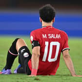 Mohamed Salah reacts after being injured during the Africa Cup of Nations (CAN) 2024 group B football match between Egypt and Ghana at the Felix Houphouet-Boigny Stadium in Abidjan on January 18, 2024. (Photo by Issouf SANOGO / AFP) (Photo by ISSOUF SANOGO/AFP via Getty Images)