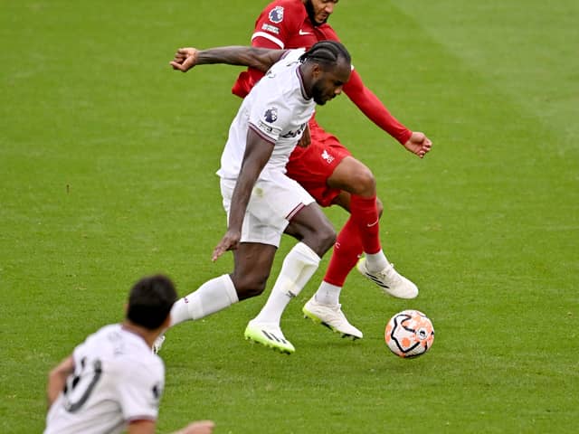 Joe Gomez of Liverpool competing with Michail Antonio of West Ham United during the Premier League match between Liverpool FC and West Ham United at Anfield on September 24, 2023 in Liverpool, England. (Photo by Andrew Powell/Liverpool FC via Getty Images)