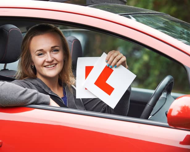 A woman passes her driving test. Image: stock.adobe