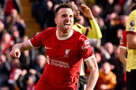 Diogo Jota of Liverpool celebrates after scoring the opening goal during the Premier League match between Liverpool FC and Burnley FC at Anfield on February 10, 2024 in Liverpool, England. (Photo by Andrew Powell/Liverpool FC via Getty Images)