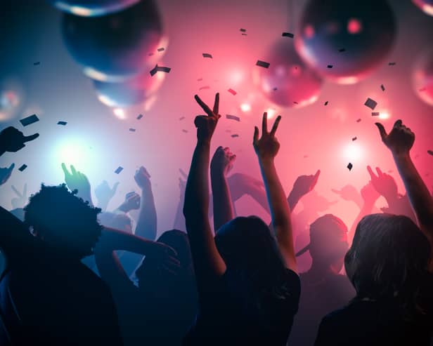 People dancing in a club. Image: vchalup - stock.adobe.com