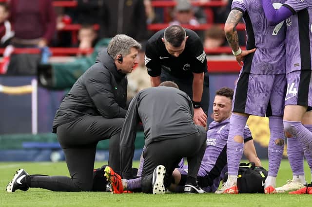 Diogo Jota of Liverpool is stretchered off after a challenge with Christian Norgaard (not pictured) during the Premier League match between Brentford FC and Liverpool FC at Gtech Community Stadium on February 17, 2024 in Brentford, England. (Photo by Ryan Pierse/Getty Images)