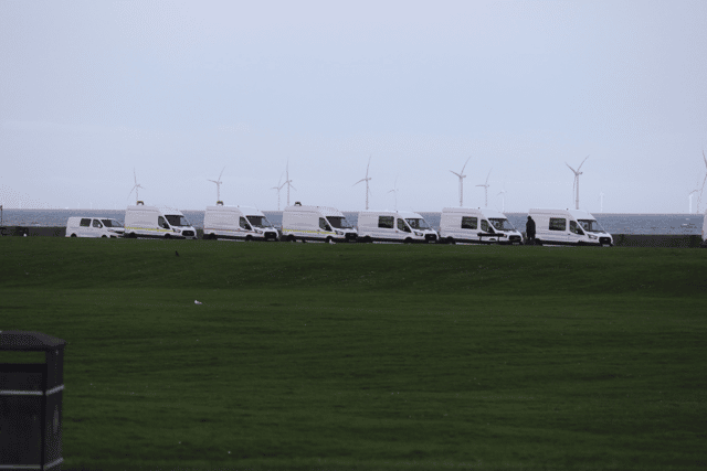 Dozens of white vans can be seen strewn across the New Brighton promenade, despite an agreement with Wirral Council. Image: Ian Fairbrother