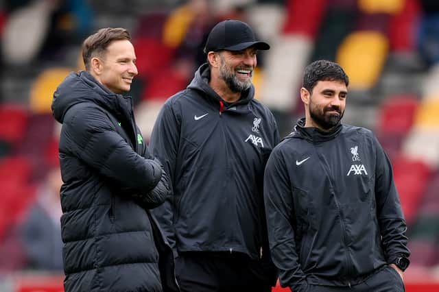 Jurgen Klopp, Manager of Liverpool, (C) speaks to his staff Pepijn Lijnders, Assistant Manager, (L) and Vitor Matos, Elite Development Coach, prior to the Premier League match between Brentford FC and Liverpool FC at Gtech Community Stadium on February 17, 2024 in Brentford, England. (Photo by Justin Setterfield/Getty Images)