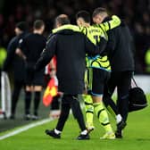 Gabriel Martinelli of Arsenal is helped off the pitch by medical staff after an injury during the Premier League match between Sheffield United and Arsenal FC at Bramall Lane on March 04, 2024 in Sheffield, England. (Photo by David Rogers/Getty Images)