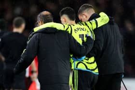 Gabriel Martinelli of Arsenal is helped off the pitch by medical staff after an injury during the Premier League match between Sheffield United and Arsenal FC at Bramall Lane on March 04, 2024 in Sheffield, England. (Photo by David Rogers/Getty Images)