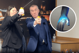 Merseyside's Police and Crime Commissioner Emily Spurrell and Nick Roach from Selectamark Security demonstrate the DNA spray. Image: LTV