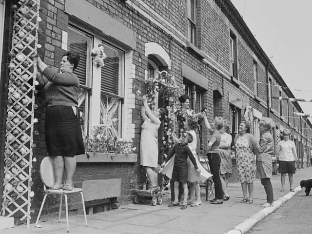 The residents of Claudia Street add the finishing touches to their decorations in preparation for the match between Bulgaria and Brazil at the nearby Goodison Park during the 1966 World Cup, Image: Central Press/Hulton Archive/Getty Images