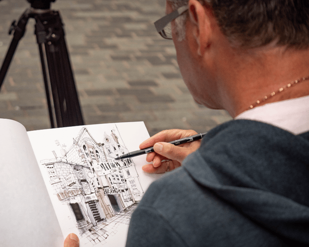 Artists Ian Fennelly sketches Matthew Street in Liverpool. Image: Urban Sketch Course
