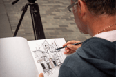 Artists Ian Fennelly sketches Matthew Street in Liverpool. Image: Urban Sketch Course