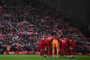 Liverpool players form a group huddle (Getty Images).