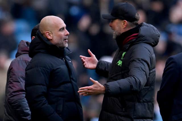 Jurgen Klopp manager of Liverpool talking with Pep Guardiola manager of Manchester City during the Premier League match between Manchester City and Liverpool FC at Etihad Stadium on November 25, 2023 in Manchester, England. (Photo by Andrew Powell/Liverpool FC via Getty Images)