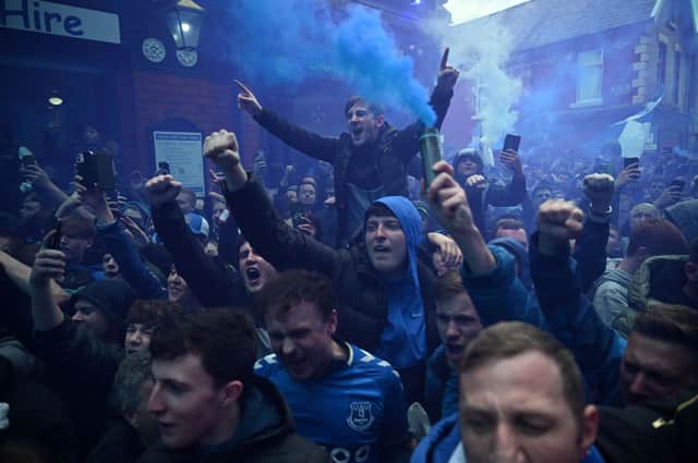 Everton fans outside Goodison Park. (Photo by OLI SCARFF/AFP via Getty Images)