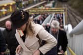 Racegoers arrive at Aintree station for the Grand National. Image: OLI SCARFF/AFP via Getty Images