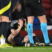 Scotland captain Andrew Robertson reacts after picking up an injury and subsequently being substituted during the international friendly match between Scotland and Northern Ireland at Hampden Park on March 26, 2024 in Glasgow, Scotland. (Photo by Stu Forster/Getty Images)