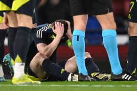 Scotland captain Andrew Robertson reacts after picking up an injury and subsequently being substituted during the international friendly match between Scotland and Northern Ireland at Hampden Park on March 26, 2024 in Glasgow, Scotland. (Photo by Stu Forster/Getty Images)