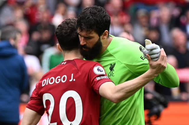 Liverpool pair Diogo Jota and Alisson Becker. (Photo by Andrew Powell/Liverpool FC via Getty Images)