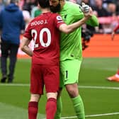 Liverpool pair Diogo Jota and Alisson Becker. (Photo by Andrew Powell/Liverpool FC via Getty Images)