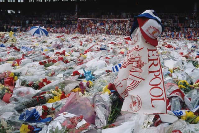 Floral tributes cover the pitch at Anfield after 97 Liverpool fans died as a result of a crush at Hillsborough Stadium in 1989.