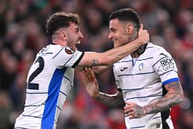 Gianluca Scamacca (r) of Atalanta BC celebrates with Matteo Ruggeri of Atalanta BC after scoring his team's first goal during the UEFA Europa League 2023/24 Quarter-Final first leg match between Liverpool FC and Atalanta at Anfield on April 11, 2024 in Liverpool, England. (Photo by Stu Forster/Getty Images)