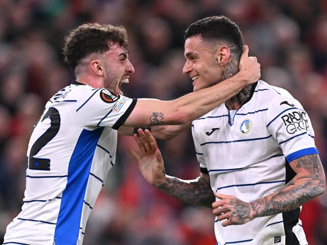 Gianluca Scamacca (r) of Atalanta BC celebrates with Matteo Ruggeri of Atalanta BC after scoring his team's first goal during the UEFA Europa League 2023/24 Quarter-Final first leg match between Liverpool FC and Atalanta at Anfield on April 11, 2024 in Liverpool, England. (Photo by Stu Forster/Getty Images)