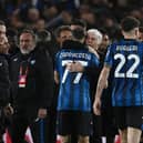 Atalanta players and head coach Gian Piero Gasperini celebrate after winning the UEFA Europa League quarter-final against Liverpool. (Photo by ISABELLA BONOTTO/AFP via Getty Images)