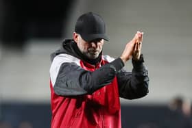 Jurgen Klopp, Manager of Liverpool, applauds the fans following his side's elimination from the UEFA Europa League after the UEFA Europa League 2023/24 Quarter-Final second leg match between Atalanta and Liverpool FC at Stadio Atleti Azzurri d'Italia on April 18, 2024 in Bergamo, Italy. (Photo by Marco Luzzani/Getty Images)