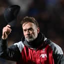 Jurgen Klopp, Manager of Liverpool, acknowledges the fans by taking his cap off following his side's elimination from the UEFA Europa League after the UEFA Europa League 2023/24 Quarter-Final second leg match between Atalanta and Liverpool FC at Stadio Atleti Azzurri d'Italia on April 18, 2024 in Bergamo, Italy. (Photo by Dan Mullan/Getty Images)