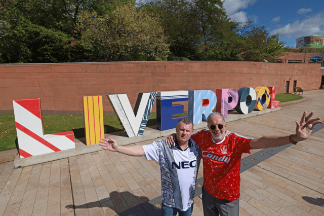 Football legends Mark Lawrenson, former Liverpool FC player, and Graham Stuart, former Everton FC player, officially unveiled a new look for the giant Liverpool sign in the heart of the city today. Image: Liverpool ONE