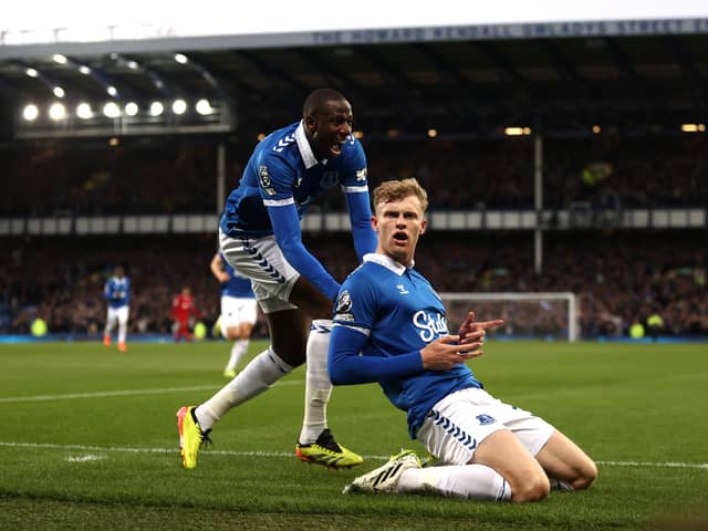 Jarrad Branthwaite of Everton celebrates scoring his team's first goal with Abdoulaye Doucoure during the Premier League match between Everton FC and Liverpool FC at Goodison Park on April 24, 2024 in Liverpool, England. (Photo by Naomi Baker/Getty Images)
