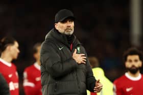 Jurgen Klopp, Manager of Liverpool, holds the Liverpool badge on his coat after the team's defeat in the Premier League match between Everton FC and Liverpool FC at Goodison Park on April 24, 2024 in Liverpool, England. (Photo by Naomi Baker/Getty Images)