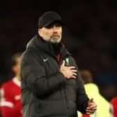 Jurgen Klopp, Manager of Liverpool, holds the Liverpool badge on his coat after the team's defeat in the Premier League match between Everton FC and Liverpool FC at Goodison Park on April 24, 2024 in Liverpool, England. (Photo by Naomi Baker/Getty Images)