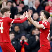 Diogo Jota of Liverpool celebrates with Conor Bradley of Liverpool after scoring his team's third goal during the Emirates FA Cup Fourth Round match between Liverpool and Norwich City at Anfield on January 28, 2024 in Liverpool, England. (Photo by Clive Brunskill/Getty Images)
