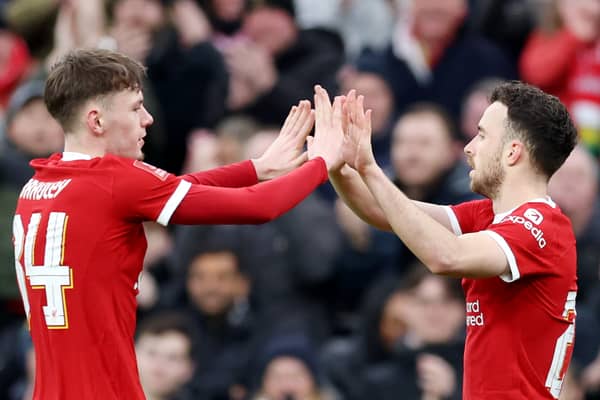 Diogo Jota of Liverpool celebrates with Conor Bradley of Liverpool after scoring his team's third goal during the Emirates FA Cup Fourth Round match between Liverpool and Norwich City at Anfield on January 28, 2024 in Liverpool, England. (Photo by Clive Brunskill/Getty Images)